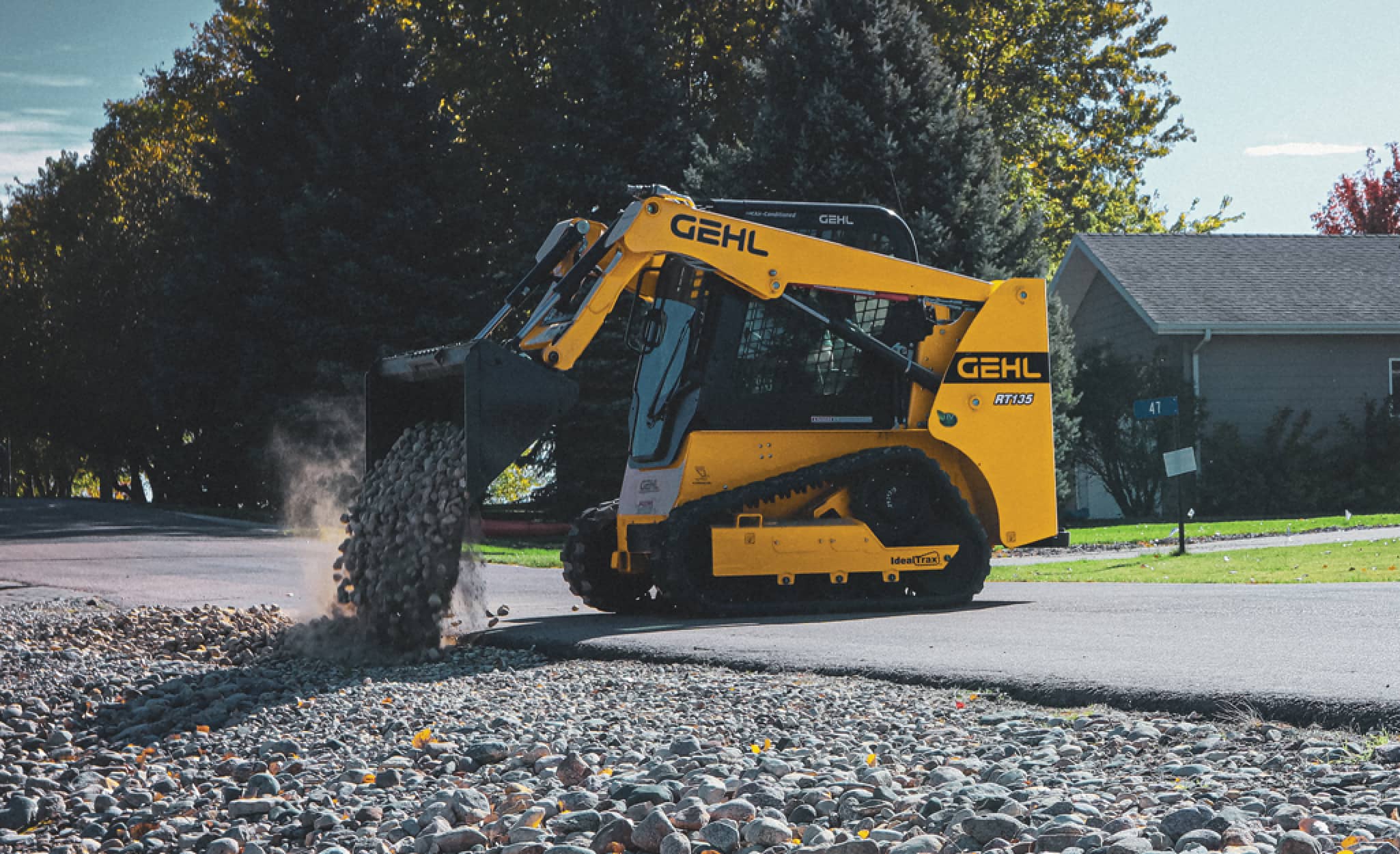 A skid steer emptying its bucket. A skid steer emptying its bucket.