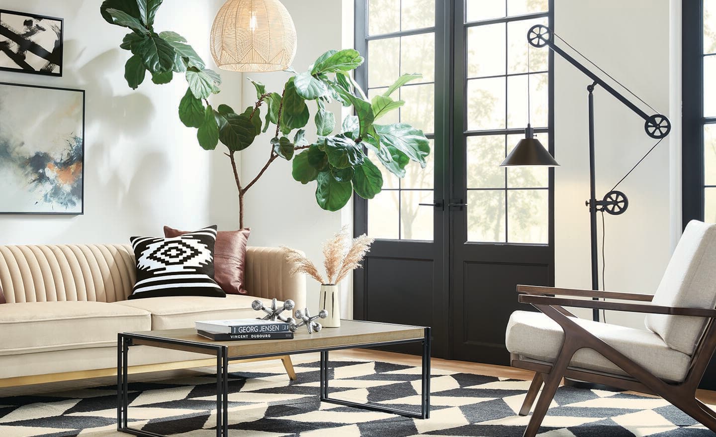 A floor lamp lights the corner of a living room.