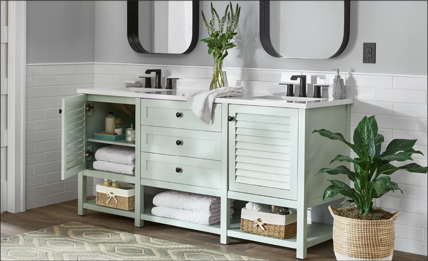 Bathroom vanity cabinet in soft green color with white countertops