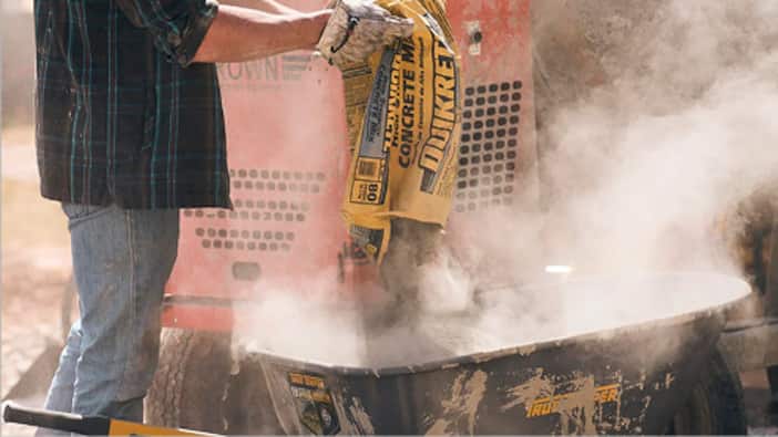 A Pro mixes concrete.