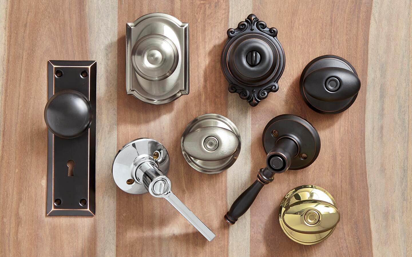 An assortment of door hardware lying on a table.