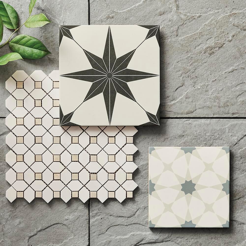 Tiles featuring different designs placed on a tile background.