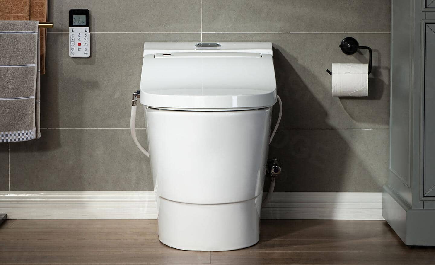 A small bath featuring a smart toilet.