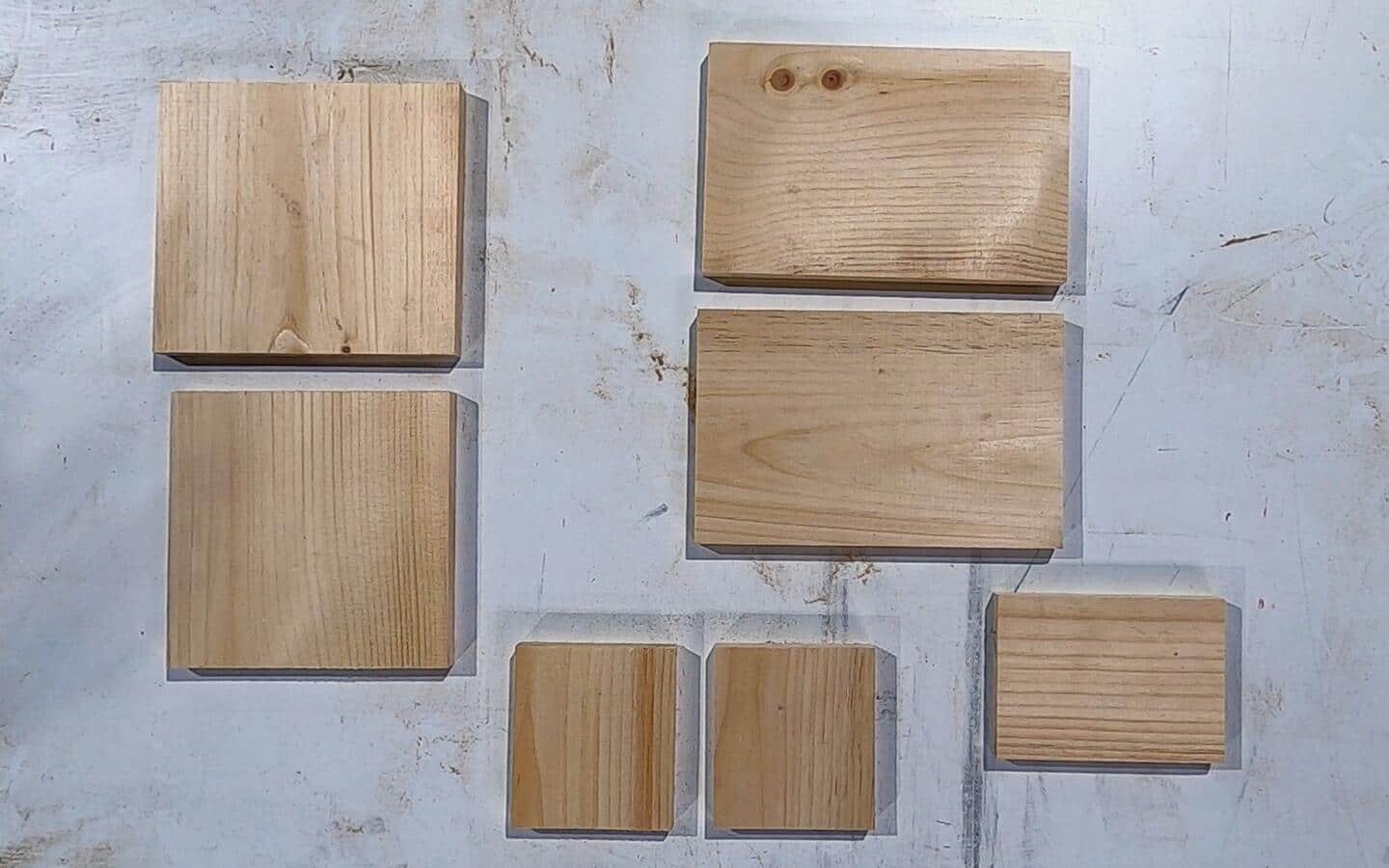 The wood cuts needed for a birdhouse construction project.