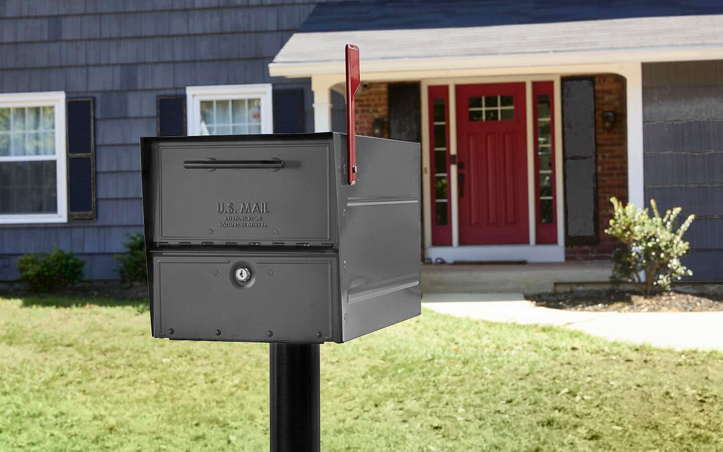 A standard size mailbox placed outside a home. A standard size mailbox placed outside a home.