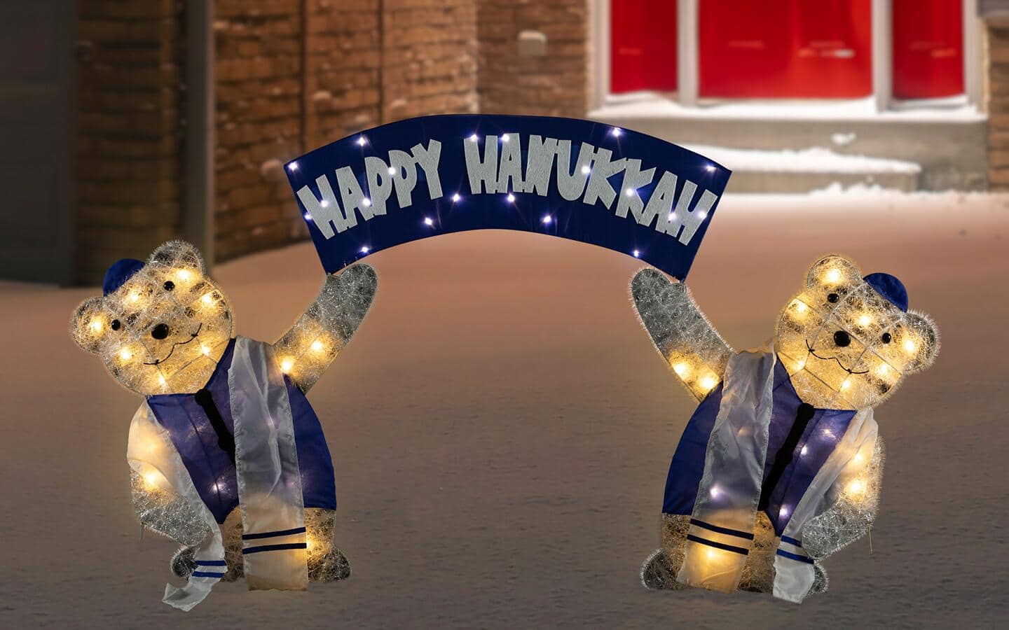 A Happy Hanukkah holiday light display decorated with bears. A Happy Hanukkah holiday light display decorated with bears.