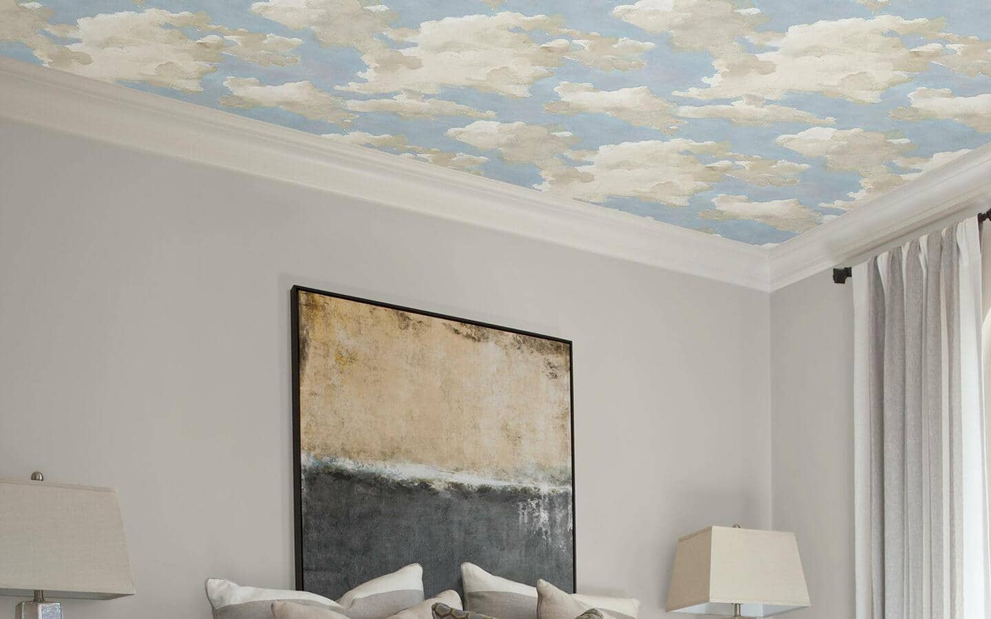 A ceiling covered in peel and stick wallpaper in a whimsical cloud design. A ceiling covered in peel and stick wallpaper in a whimsical cloud design.