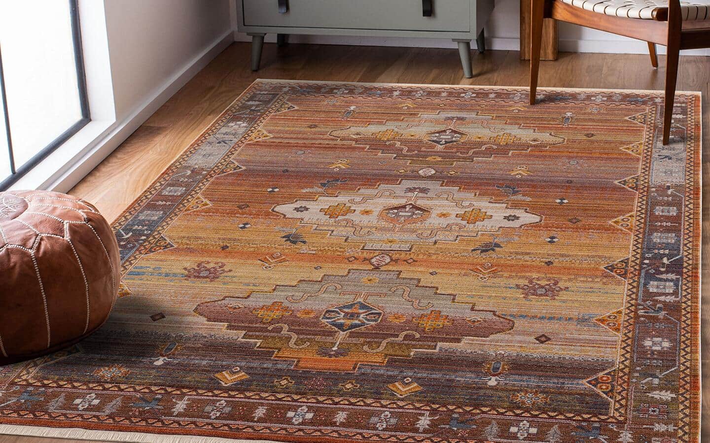 A southwestern rug lays in front of a patio door.