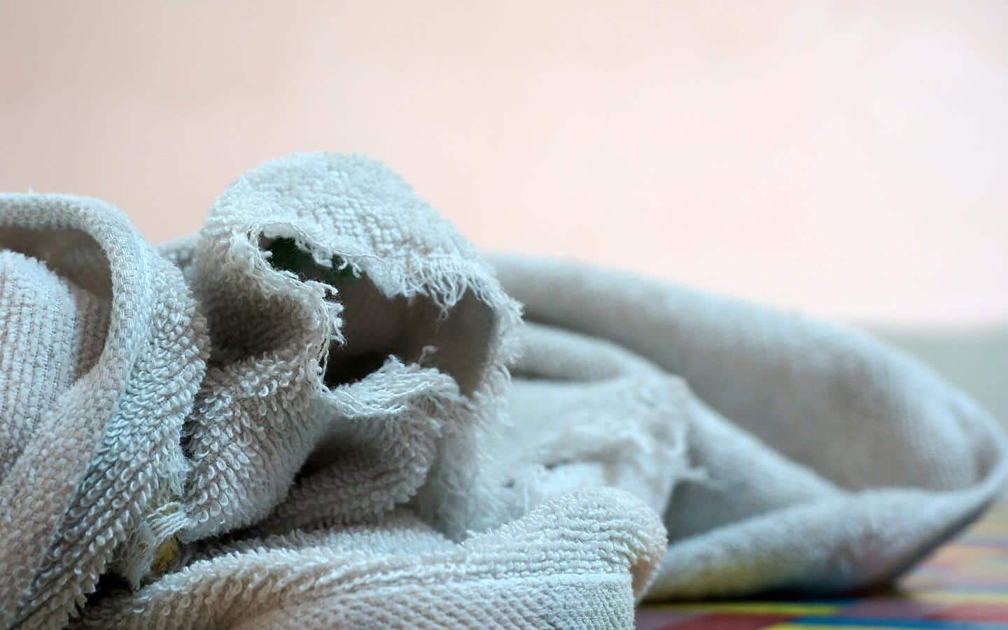 A frayed, aqua-colored towel. A frayed, aqua-colored towel.