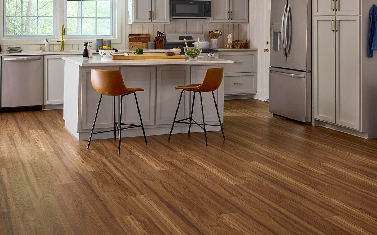 Vinyl flooring installed in a kitchen with an island.