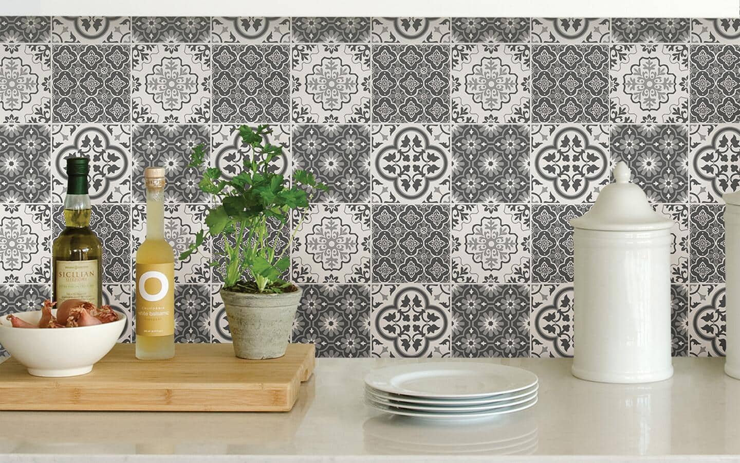 Peel and stick wallpaper in a black and white tile design installed as a kitchen counter backsplash. Peel and stick wallpaper in a black and white tile design installed as a kitchen counter backsplash.