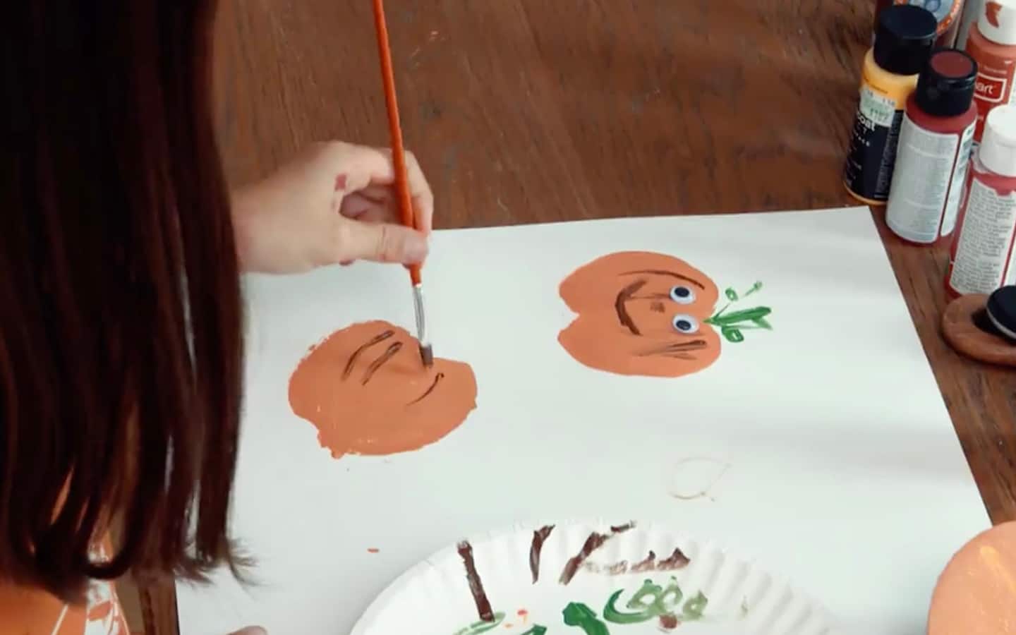 Additional paint is added to the pumpkin shape imprint. Additional paint is added to the pumpkin shape imprint.