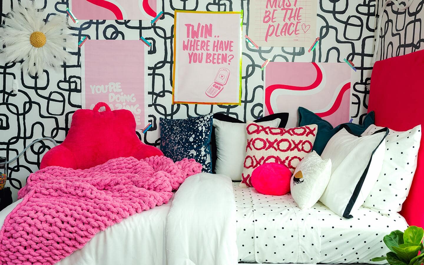 Modern and stylish dorm room bed covered in colorful pillows and throws. Modern and stylish dorm room bed covered in colorful pillows and throws.