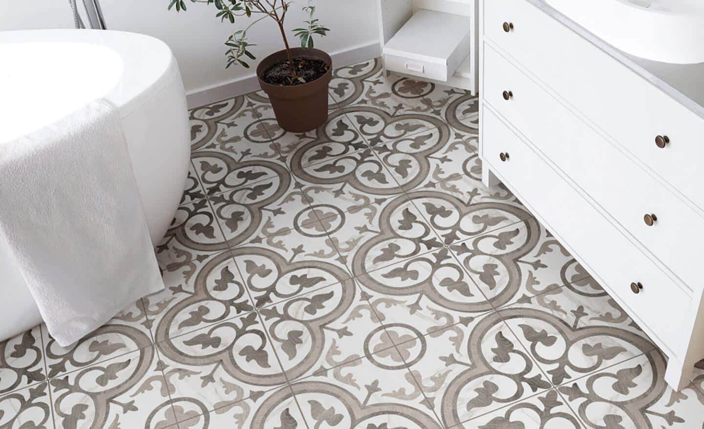 Patterned vinyl flooring installed in a small bath.