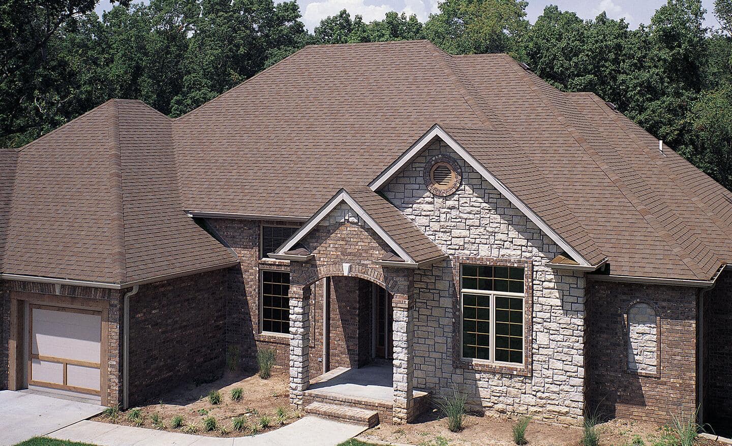 A house featuring a slate tile roof.