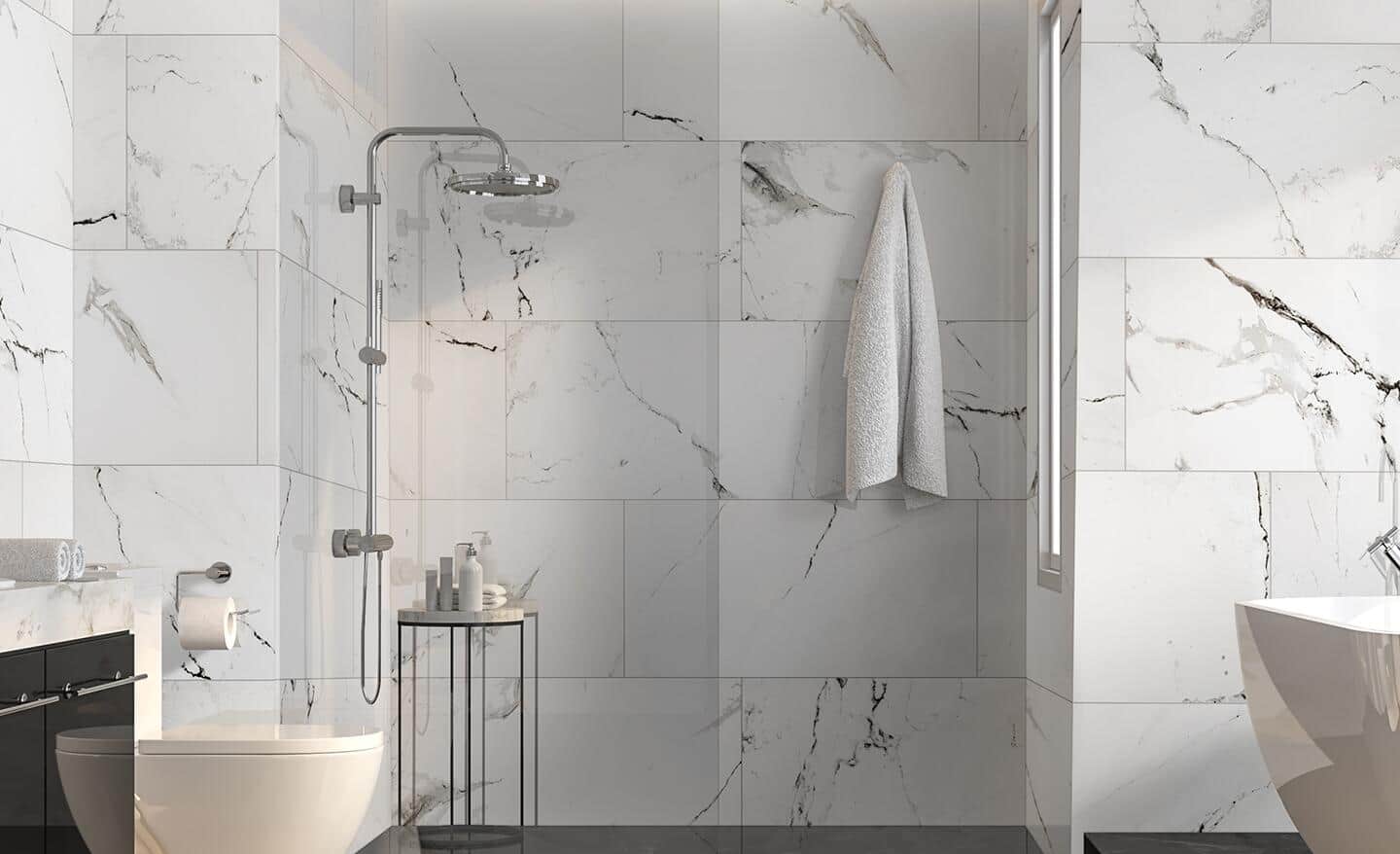 Gray and white marble tiles installed in a shower.