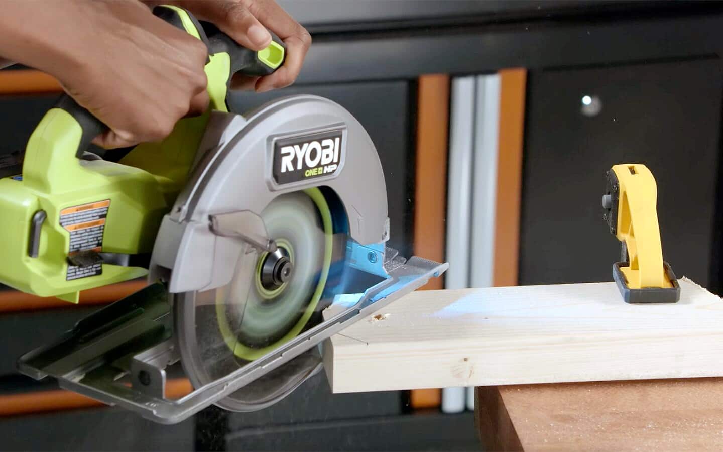 Someone cutting a cornhole game board leg with a table saw. Someone cutting a cornhole game board leg with a table saw.