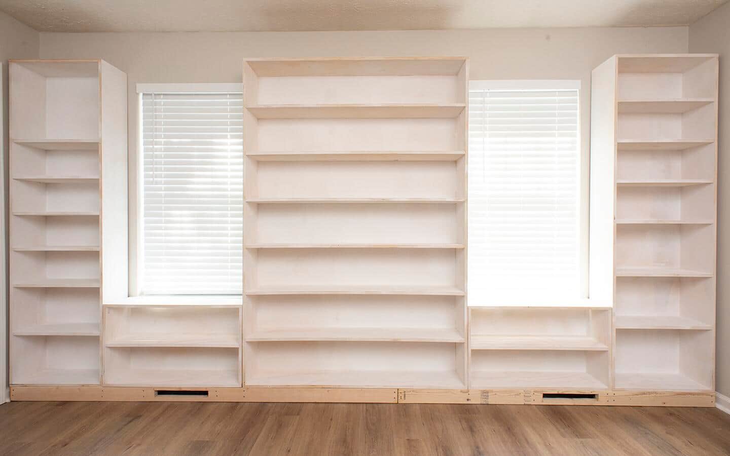 The fifth part of a built in shelving unit is installed.