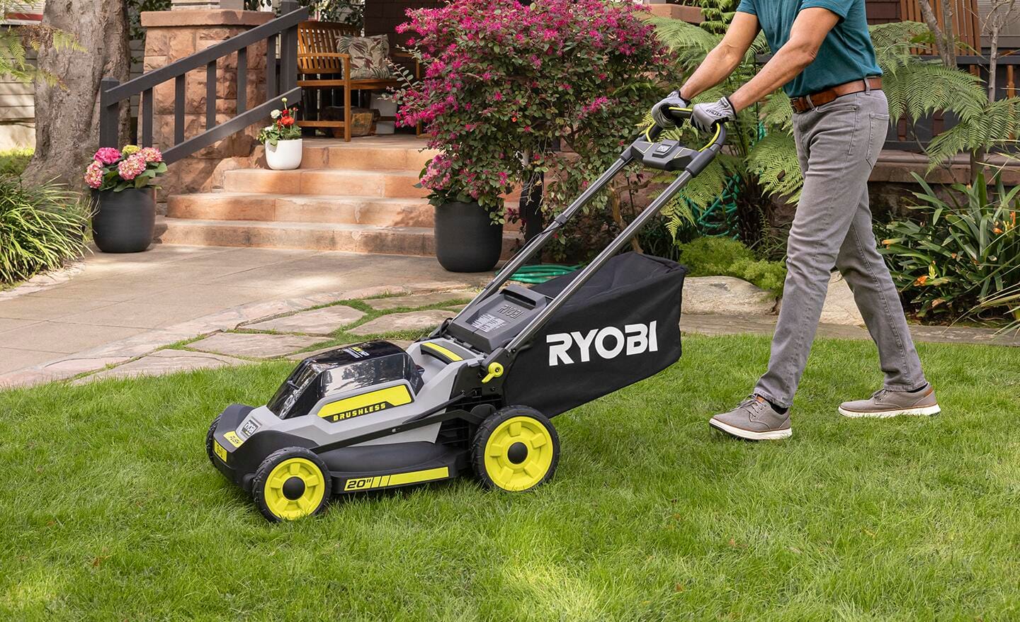 A person mows a lawn with a lawnmower. A person mows a lawn with a lawnmower.