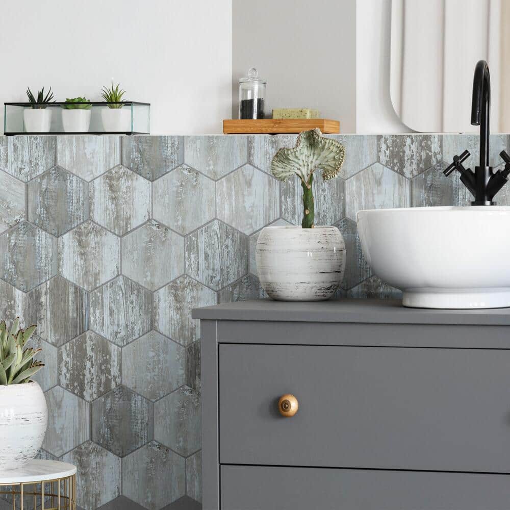 Hexagonal-shaped tile with matching grout color in a bathroom.