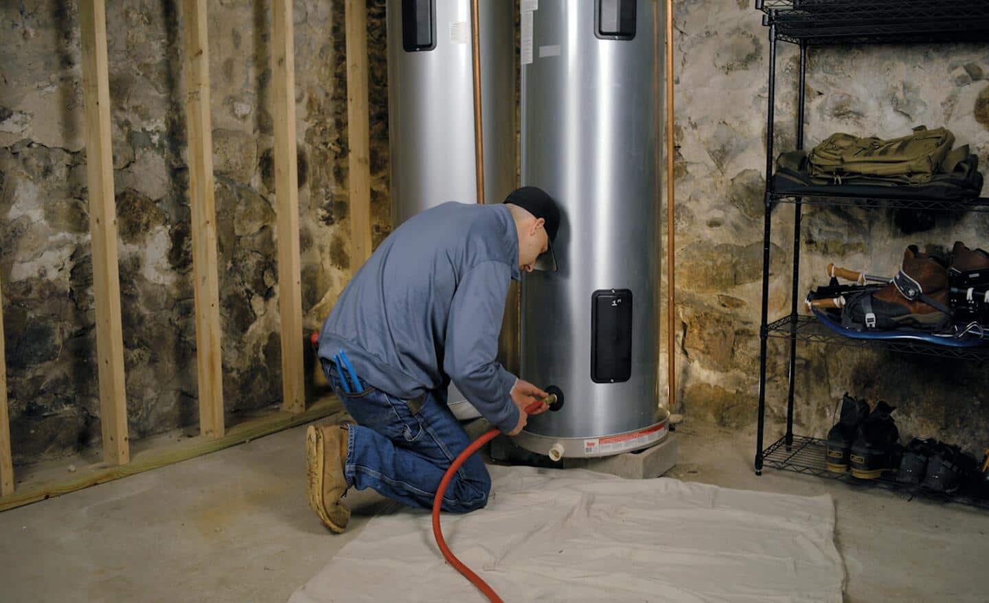 Person flushing a water heater.