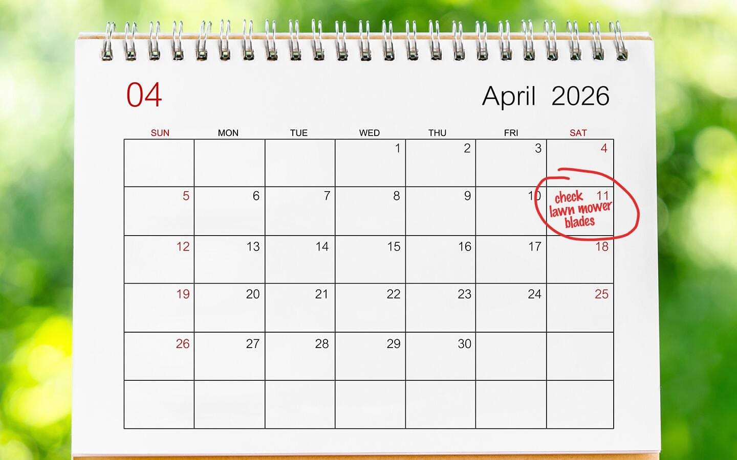 A calendar for the month of April with "check lawn mower blades" circled.