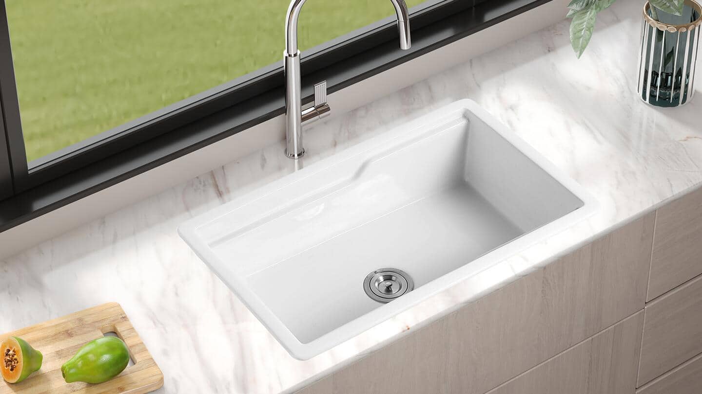An overview of a white drop-in kitchen sink. An overview of a white drop-in kitchen sink.