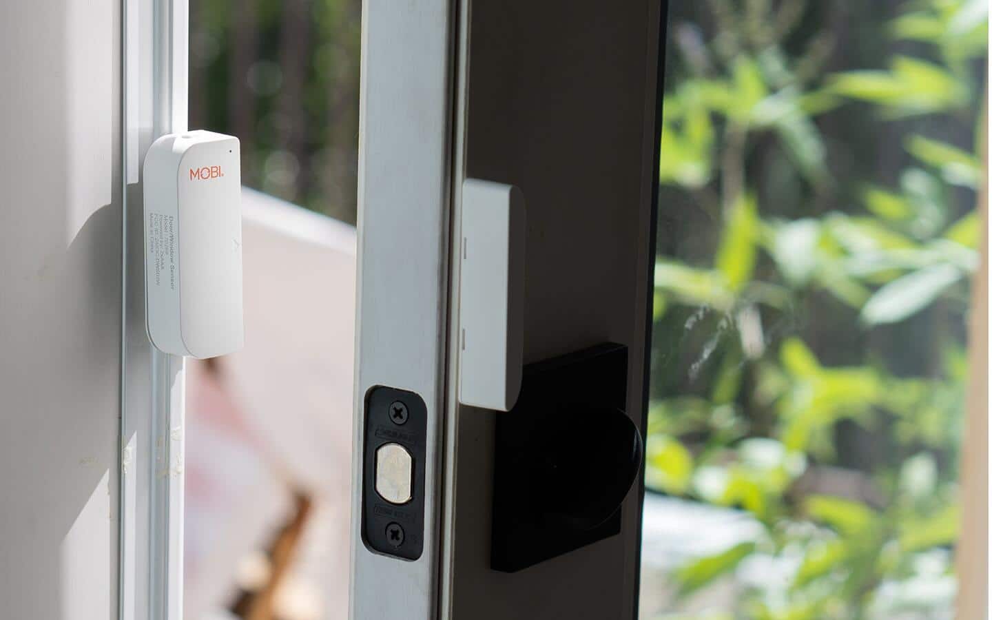 A close up view of smart contact sensors on a window.