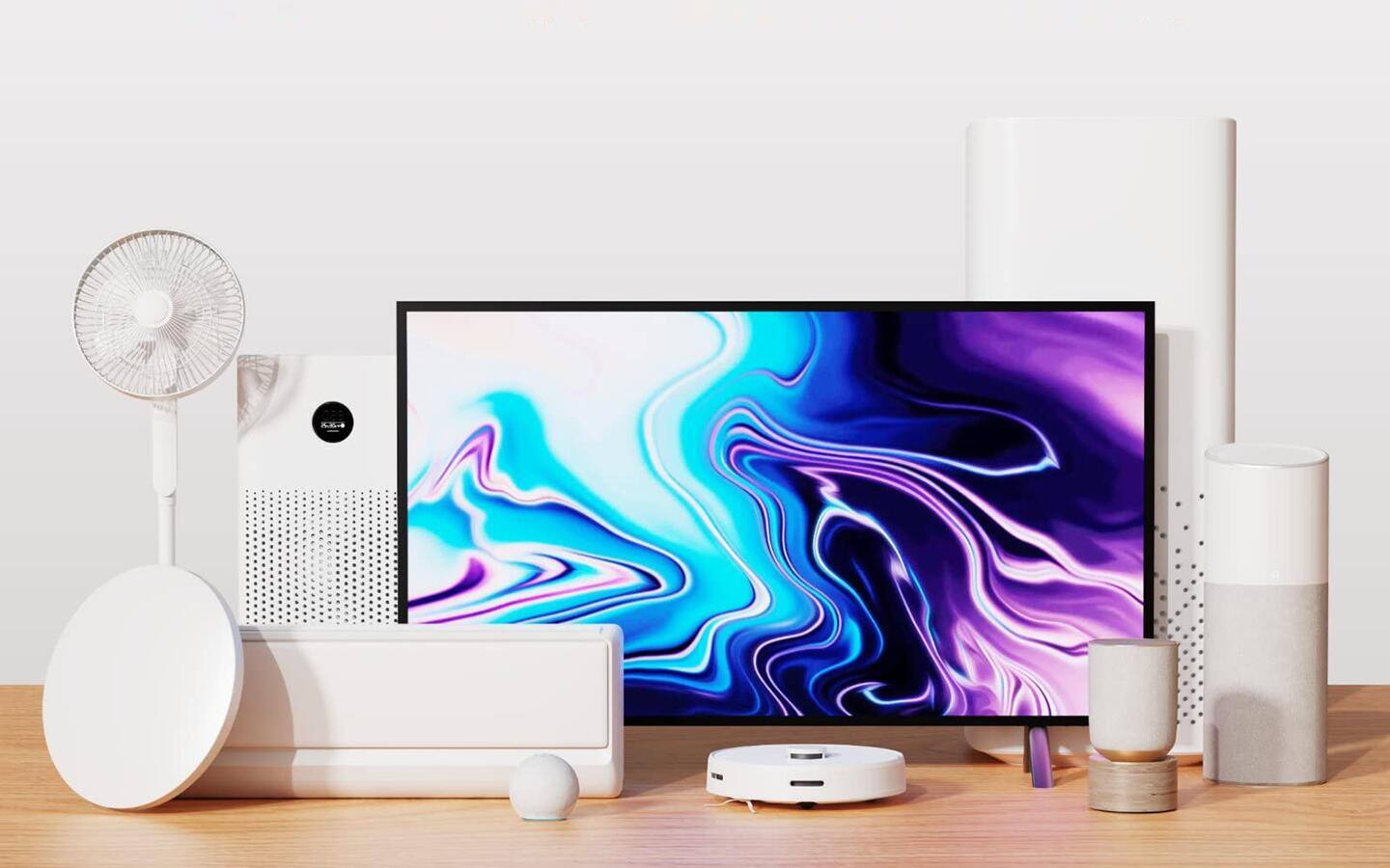 A table filled with smart home products such as a smart TV and more. A table filled with smart home products such as a smart TV and more.