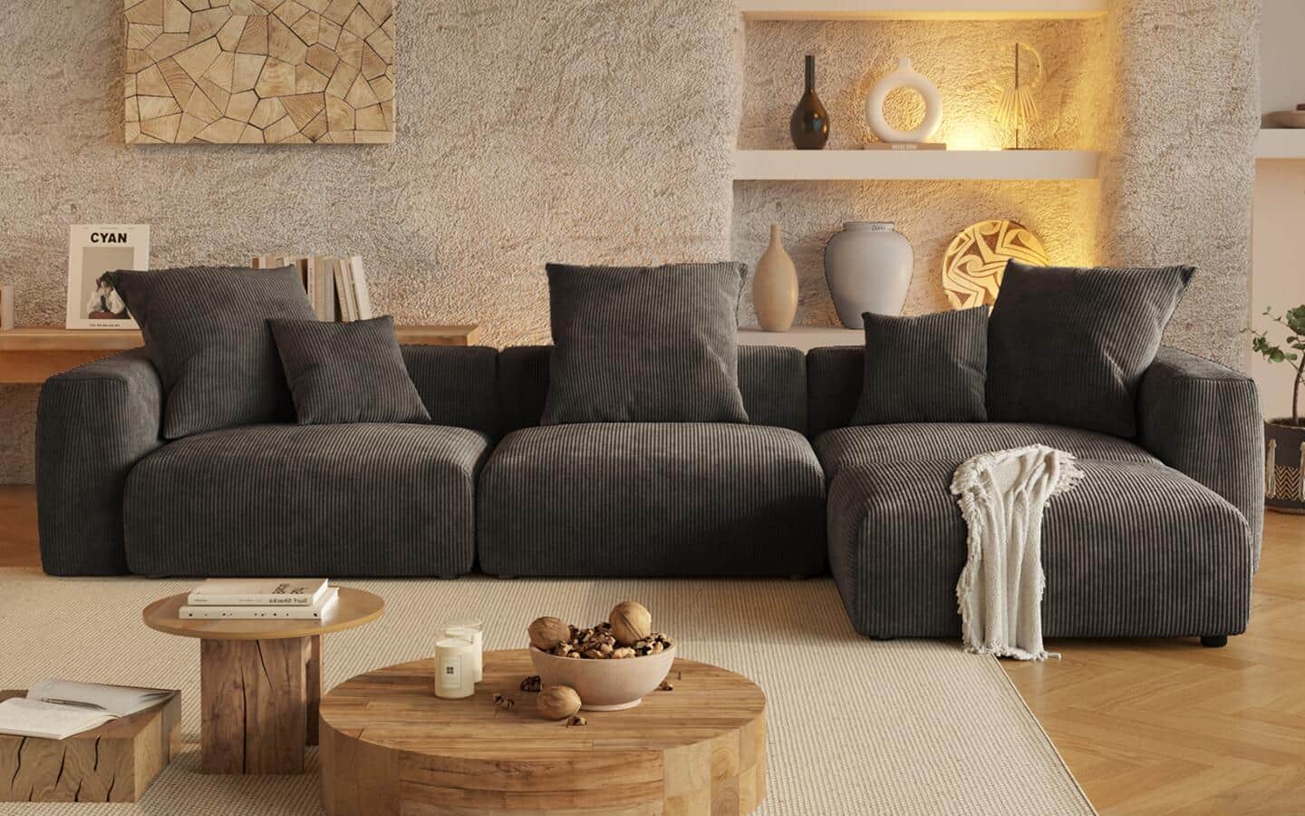 A gray modular sofa featuring a chaise lounge on its left side. A gray modular sofa featuring a chaise lounge on its left side.