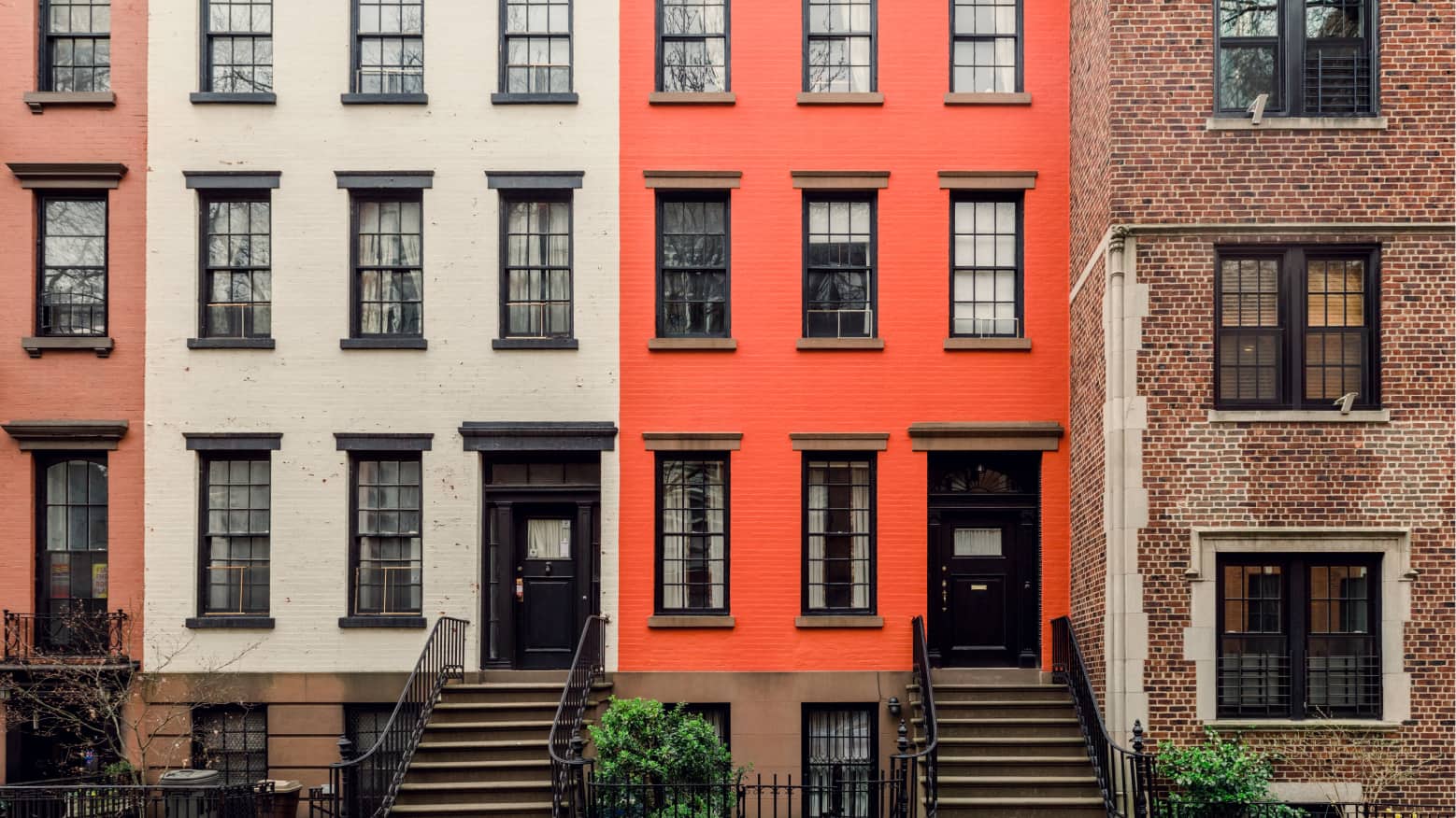 Townhouses in a row have different exterior paint.