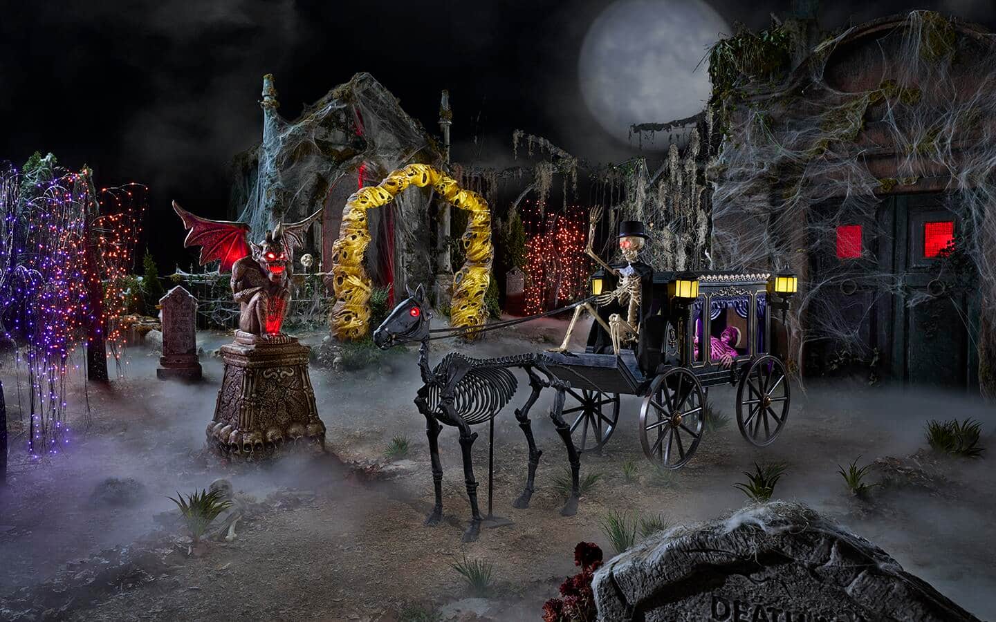 Giant Halloween figures, including a gargoyle and a hearse driver in an outdoor courtyard. Giant Halloween figures, including a gargoyle and a hearse driver in an outdoor courtyard.