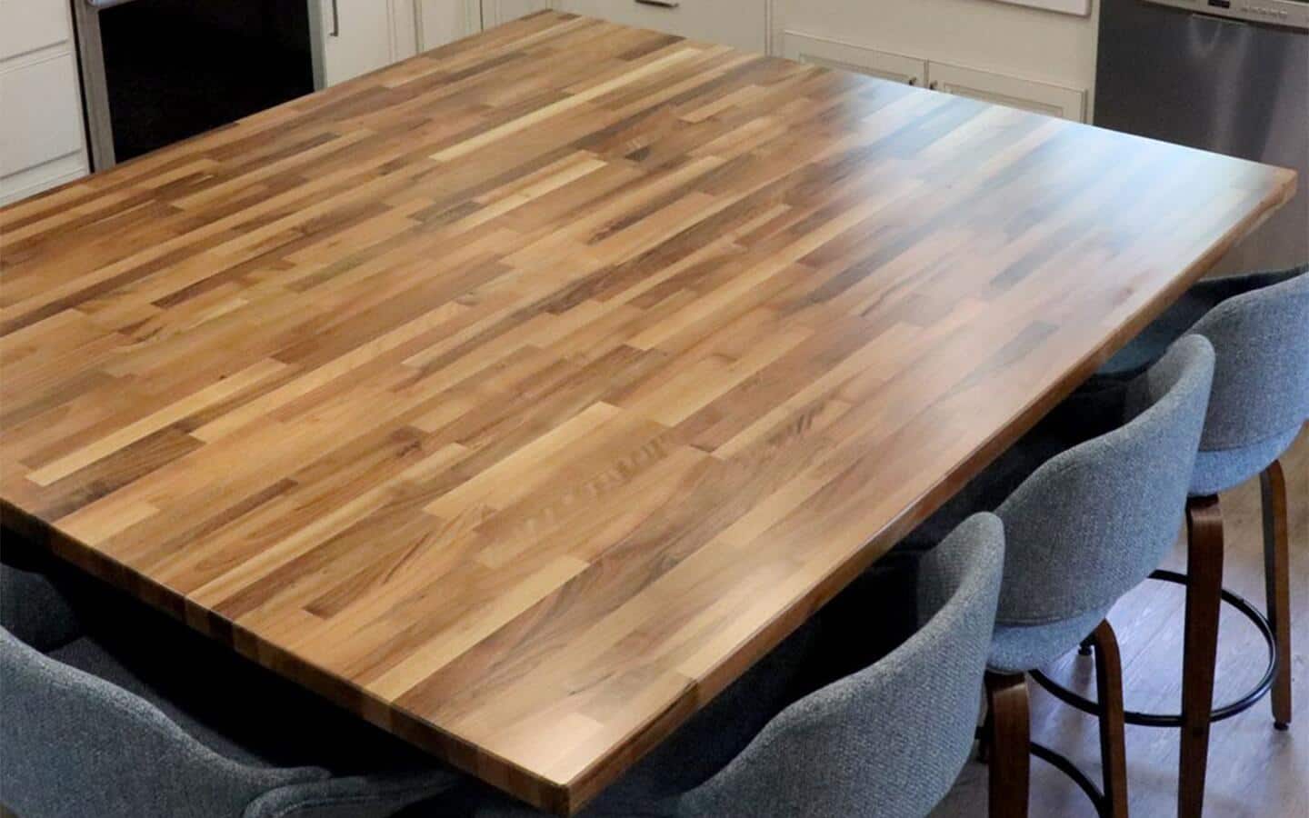 A tabletop made with butcher block material in a kitchen dining area