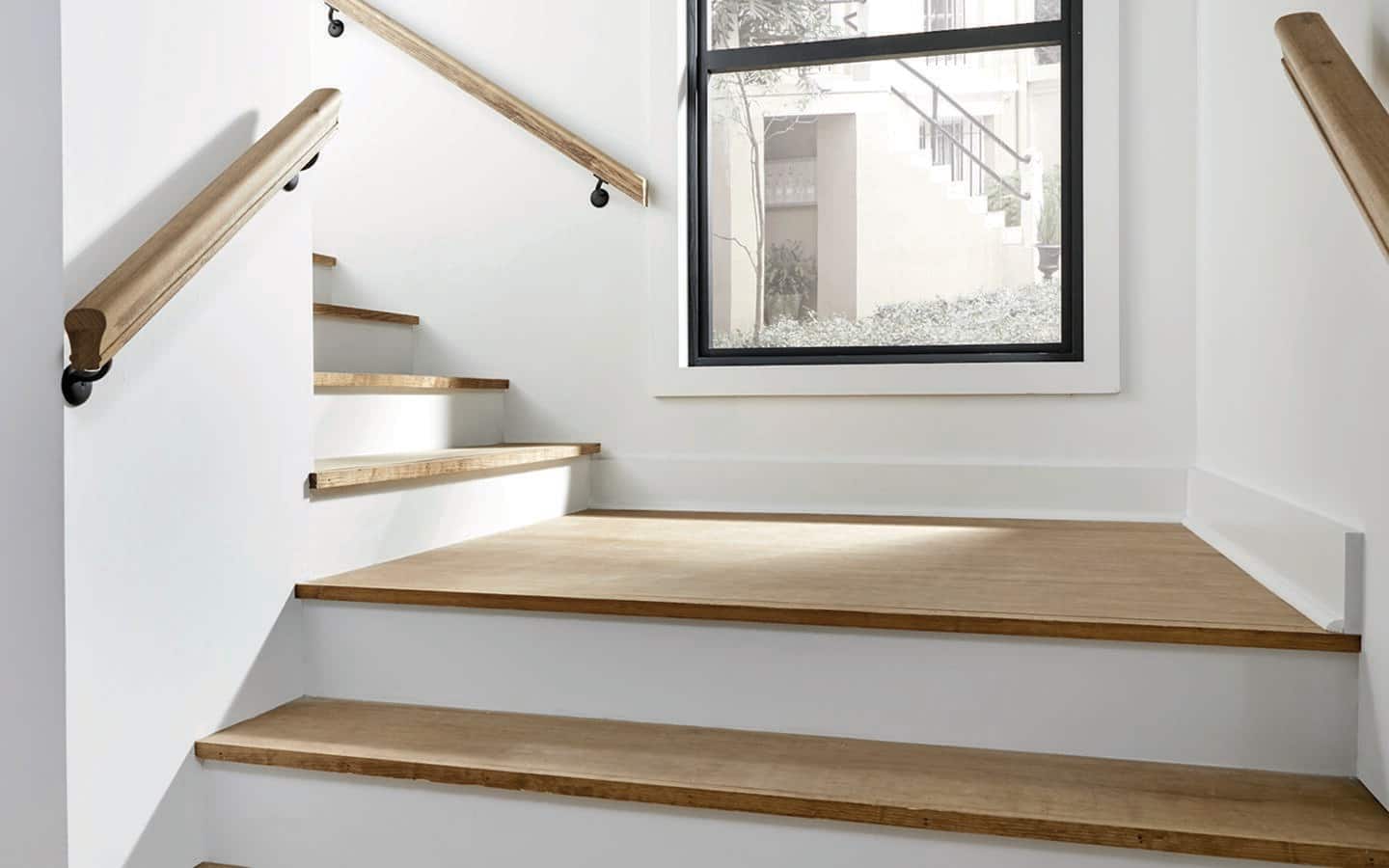 An uncarpeted, hardwood stairwell. An uncarpeted, hardwood stairwell.