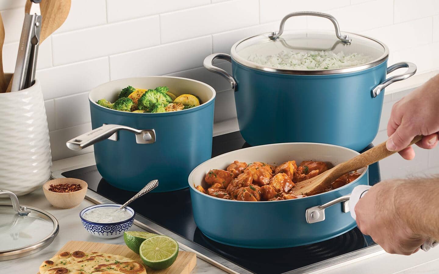 Someone using induction cookware on an induction cooktop.